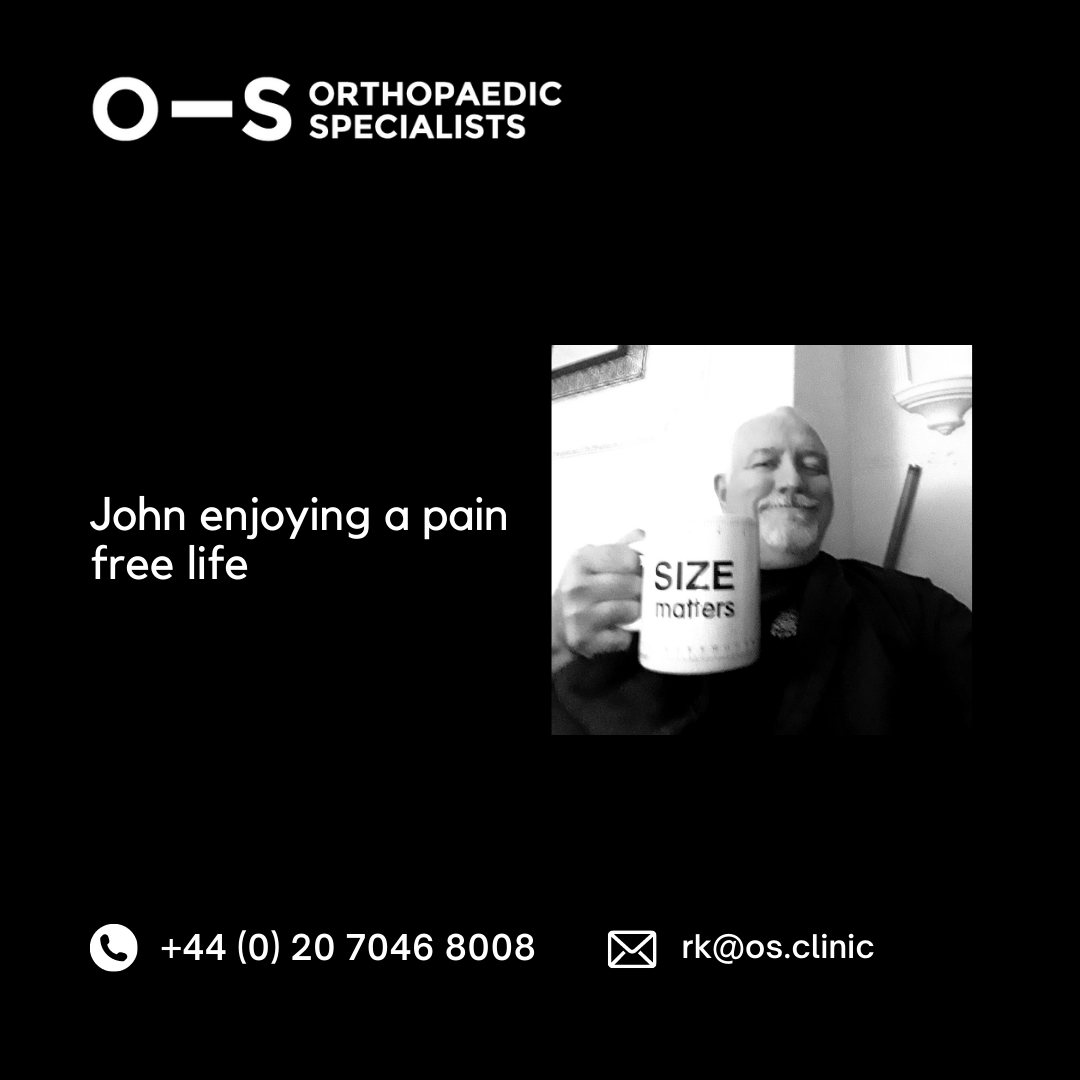 John after surgery smiling with a mug of tea