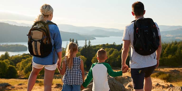 Children hiking with their parents