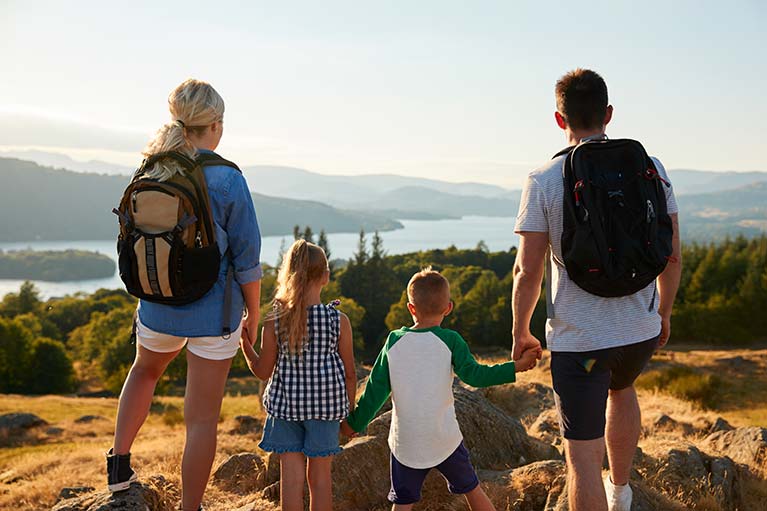 Children hiking with their parents